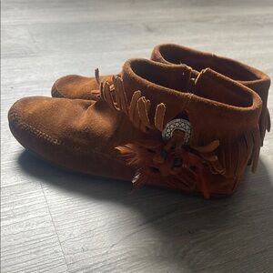Minnetonka Brown Moccasins with Fringe and Feather Detail